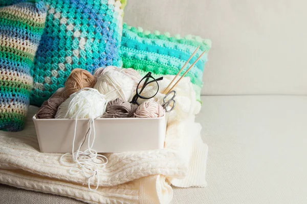 Yarn in a basket of beige and neutral, natural tones, knitting a — Stock Photo, Image