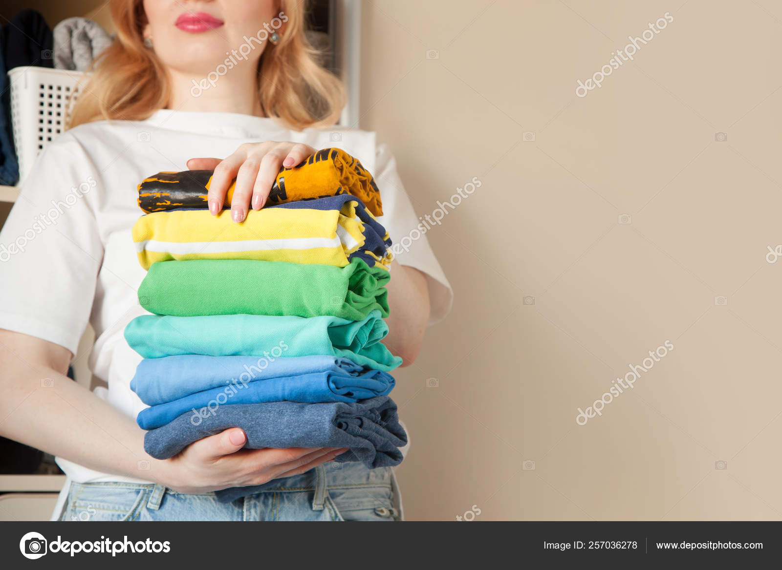 Woman Folds Clothes Vertically On A Wardrobe Shelf Japanese Sto