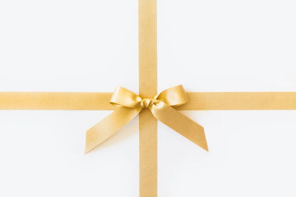 Gold ribbon with a bow as a gift on a white background — Stock Photo, Image