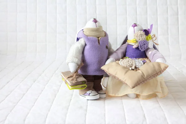 Handmade toy. Wedding couple of  purple rabbits sewn by hand.