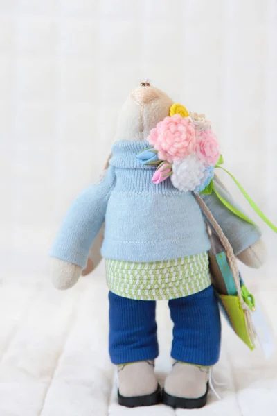 Handmade toy. Doll of textiles, fabrics and yarn. Rabbit sewn by — Stock Photo, Image