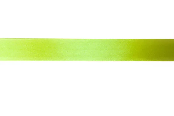 Zelená stuha s lukem jako dar na bílém pozadí — Stock fotografie
