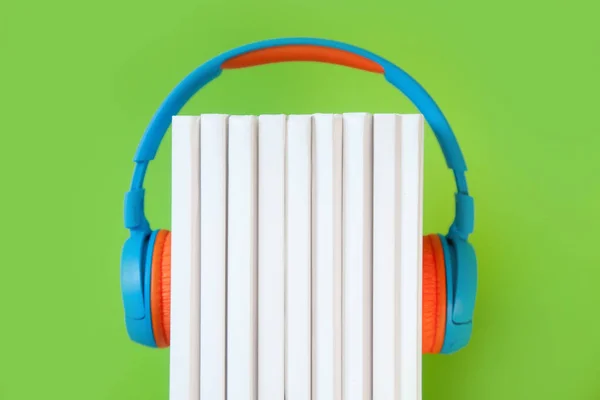 Colorful Headphone and white books on color background. Concept — Stock Photo, Image