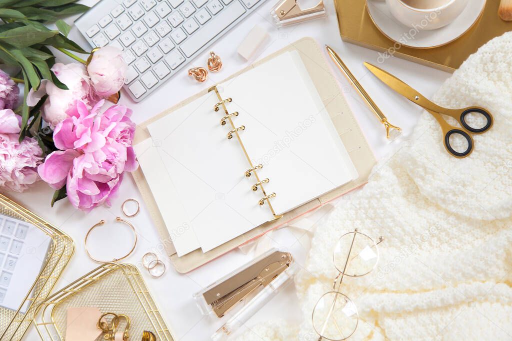 Concept female work or blogging. Gold and white stationery. Feminine space for work and creativity.