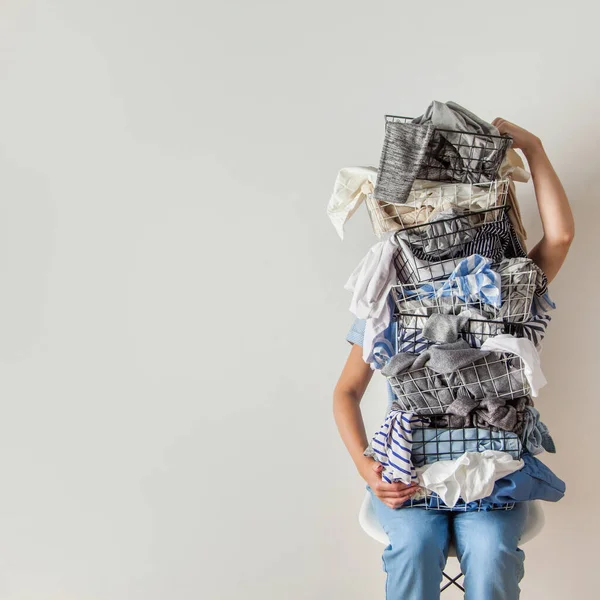 Surprised Woman Holding Metal Laundry Basket Messy Clothes White Background — Stock Photo, Image