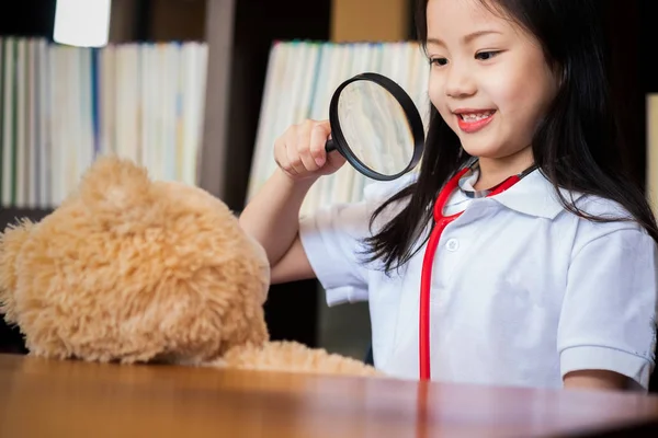 Cute Girl Enjoys Playing Magnifying Glass Toy Children Concept Medical — Stock Photo, Image