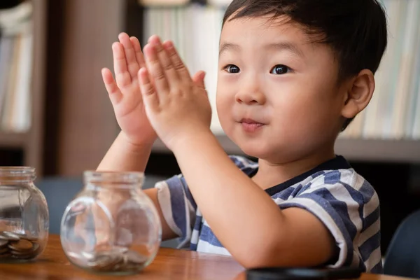 Cute Boy Putting Money Coins Glass Saving Money Concept — Stock Photo, Image