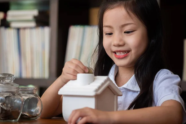 Cute Girl Putting Money Coins House Bank Saving Money Concept — Stock Photo, Image