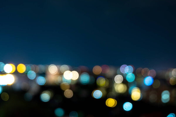 Light bokeh city landscape at night sky with many stars, blurred background concep