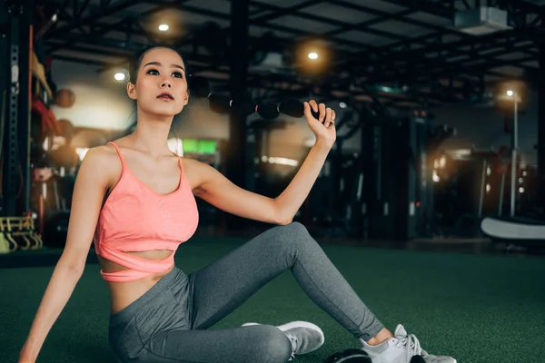 Sport woman at fitness gym club sitting relaxing after exercise — Stock Photo, Image
