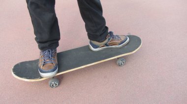 Skateboarder Feet Closeup.  Skatepark 