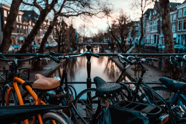 Bikes on a Bridge in Amsterdam, Netherlands Wet Overcast Weather Vacation Destination Transportation — Stock Photo, Image