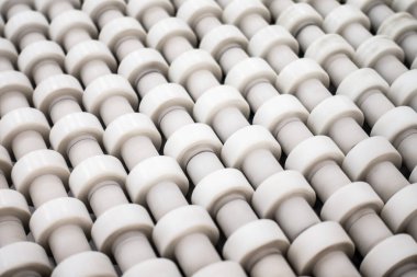 Conveyor Belt White Small Roller Wheels Closeup Detail