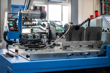 Folding Machines in Printing Production Factory. Industrial Equipment Detail