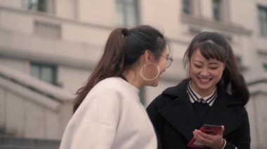 College girls talking together in the campus