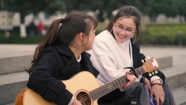 Young friend playing music together outdoor — Stock Video