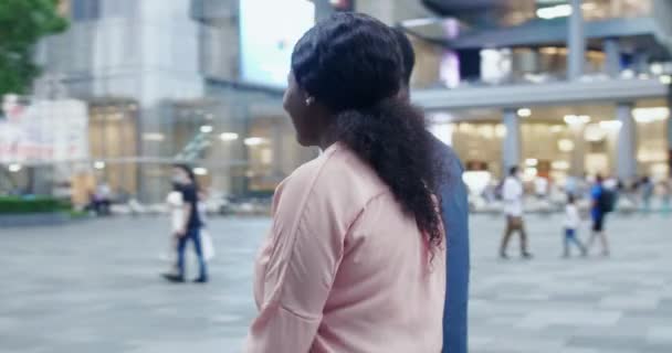 Happy African couple walking in the Chinese street — Stock Video