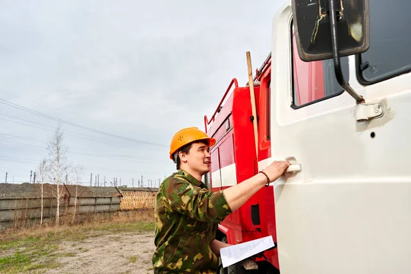 Portrait of a man firefighter, an Asian-Kazakh at work