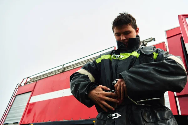 Portrait of a man firefighter, an Asian-Kazakh at work