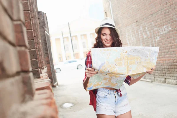 Woman Tourist Hat Checkered Shirt Holding Big Traveler Map While — Stock Photo, Image