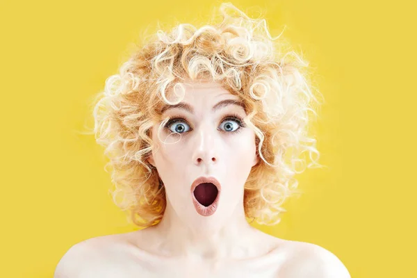 Surprised Attractive Woman Curly Hair Looking Camera Big Eyes Yellow — Stock Photo, Image