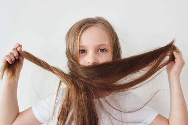 Portrait Cute Girl Wearing Shirt Looking Camera Holding Hair Hands — Stock Photo, Image