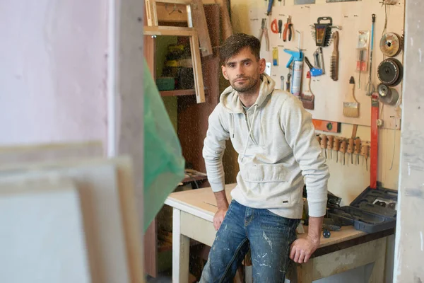 Portrait of cabinetmaker standing in home workshop, concept of make repairs in apartment — Stock Image Portrait Cabinetmaker Standing Home Workshop Concept Make Repairs Apartment Stock Image