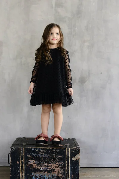 Cute Little Girl Black Evening Dress Standing Wooden Box Concrete — Stock Photo, Image