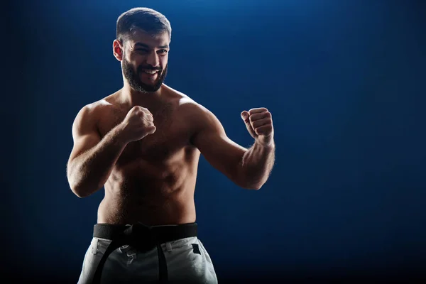 Aggressive Man Sports Trousers Standing Fighting Stance Blue Background — Stock Photo, Image