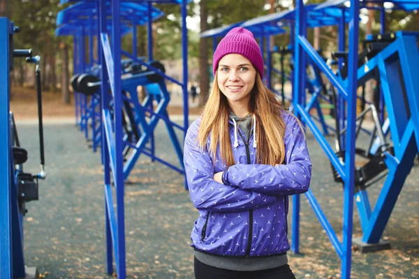 Woman Athlete Sportswear Standing Crossed Arms Outdoor Playground Equipment Woods — Stock Photo, Image