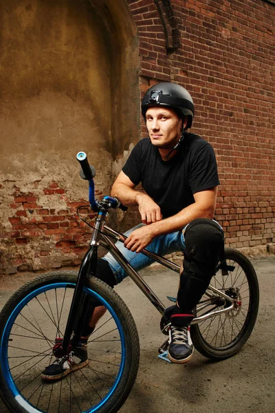 Handsome Cyclist Safety Helmet Sitting Cycle Looking Aside Side Street — Stock Photo, Image