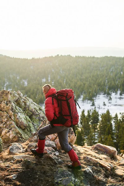 Man Rucksacks Backs Climbing Top Sunlit Mountain — Stock Photo, Image