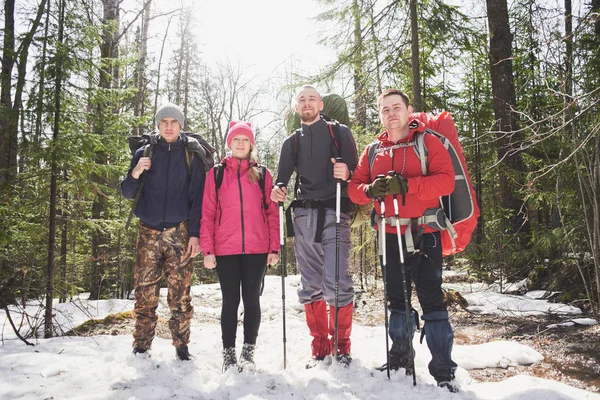 Group Happy Backpackers Rucksacks Poles Standing Snow Spring Sunny Forest — Stock Photo, Image