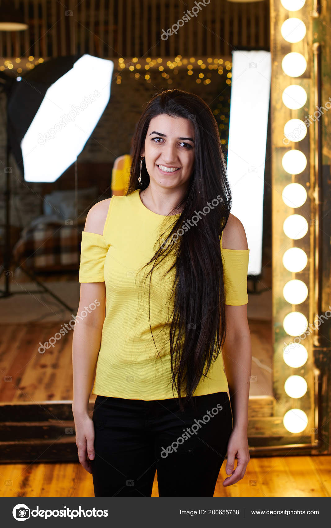 yellow top with black jeans