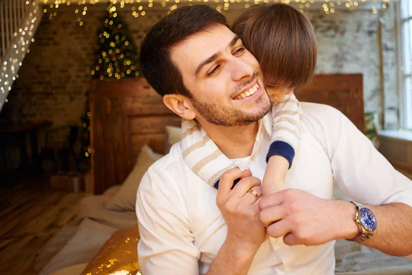 Father Son Having Fun While Sitting Bed Apartment Decorated Christmas — Stock Photo, Image