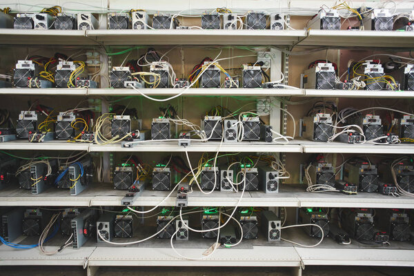 shelves with professional equipment of farm for bitcoin cryptocurrency mining 