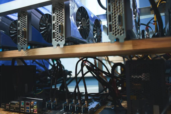 wooden shelves with farm graphics cards for mining crypto currencies