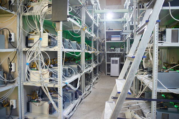 Bitcoin cryptocurrency mining farm on shelves in storage 