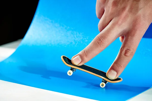 Male Fingers Doing Trick Fingerboard Blue Background Close — Stock Photo, Image