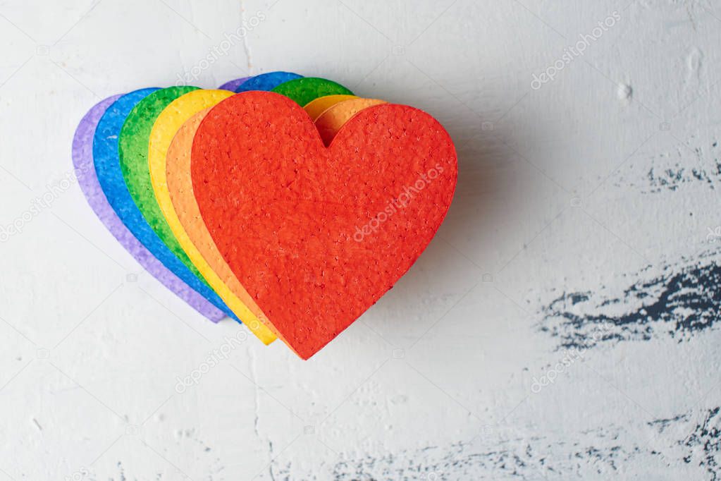 hearts painted in bright rainbow colors on grunge background, LGBT concept 