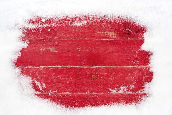 snow frame on red wooden background