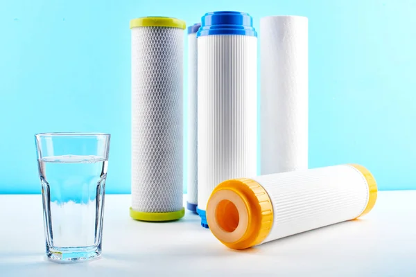 Water Filters Carbon Cartridges Glass White Blue Background Household Filtration — Stock Photo, Image