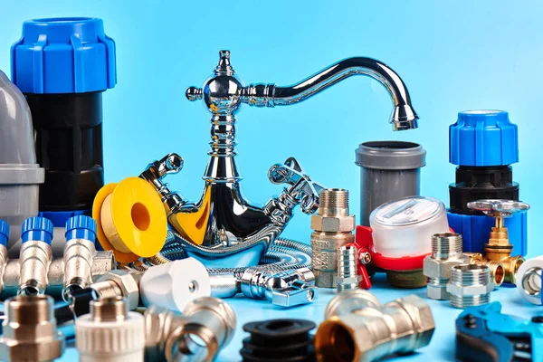 plumbing tools and equipment on blue backgroun