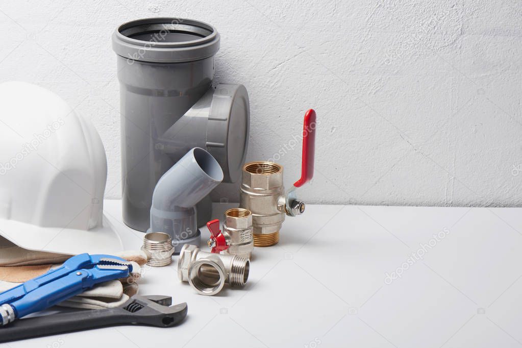 Plumbing concept, sanitary equipment. Tools and details on white background.