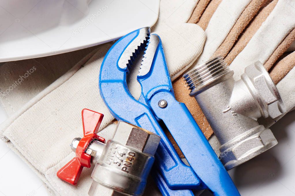 Plumbing concept, sanitary equipment. Tools and details on white background.