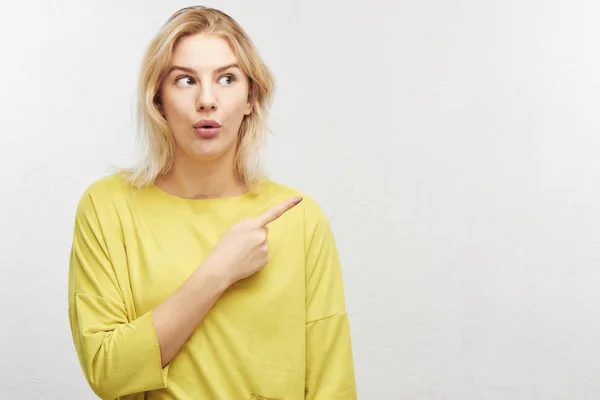 Surprised Blond Woman Open Mouth Points Upper Right Corner Index — Stock Photo, Image
