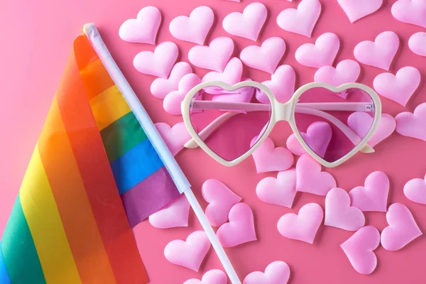 Pink glasses, hearts and rainbow flag lgbt. Gay parade