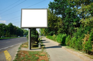 Empty billboard by the road, place for your advertisement and text clipart