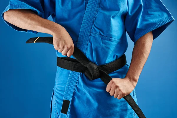 Karate Fighter Blue Kimono Uniform Tying Black Belt Hands Close — Stock Photo, Image