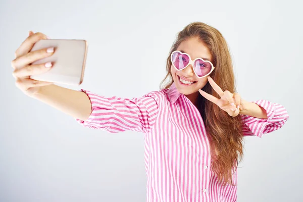 Young Funny Blogger Asian Girlmakes Selfie Phone Camera White Background — Stock Photo, Image